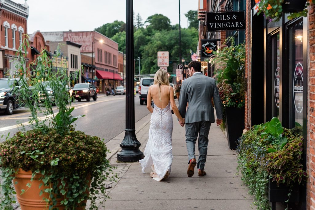 Husband and wife walking downtown Stillwater.