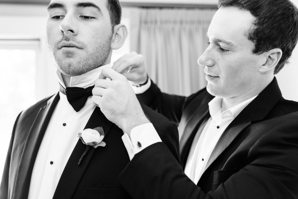 Broom and groomsmen getting ready at Lafayette Club.
