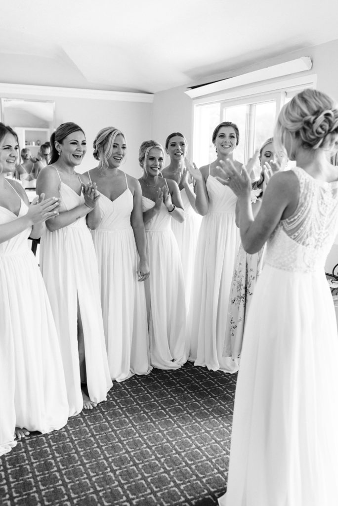Bridesmaids first look reaction with the bride.