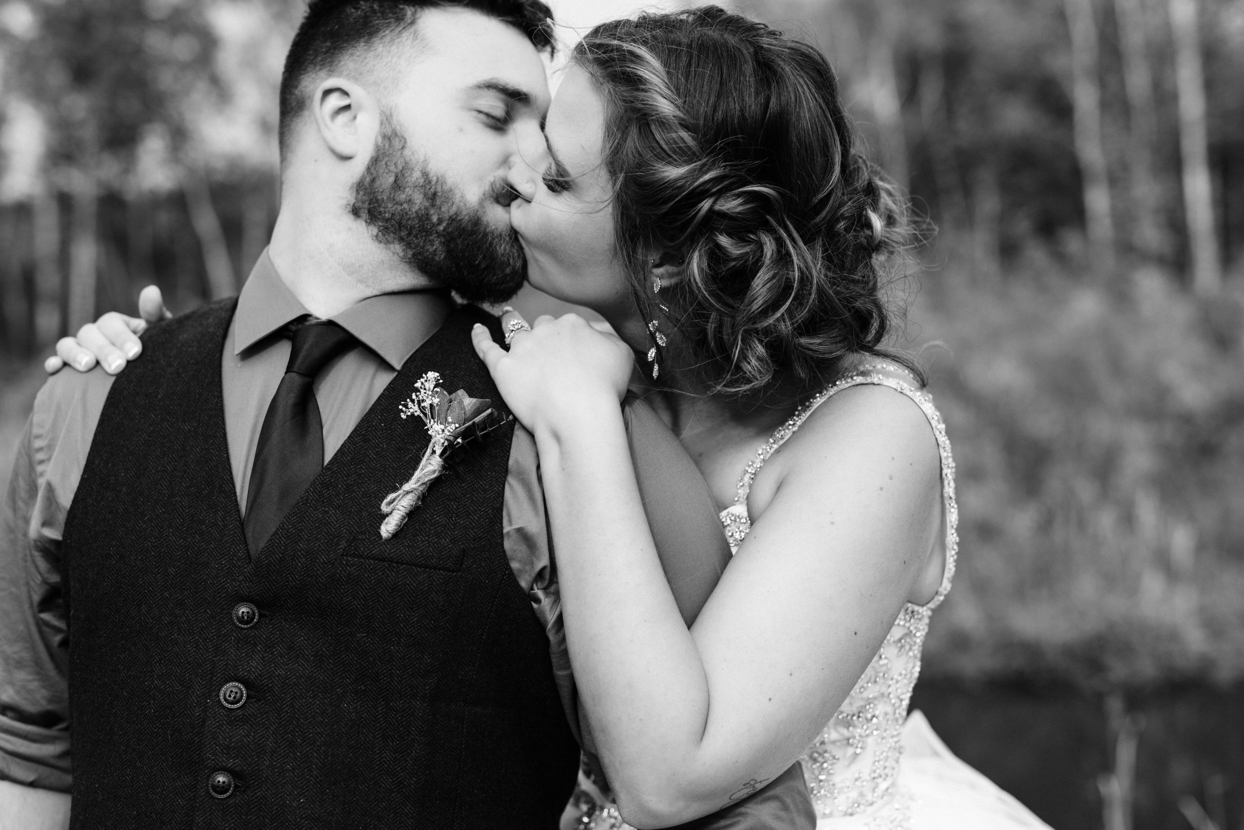 Wedding couple kissing each other on wedding day.