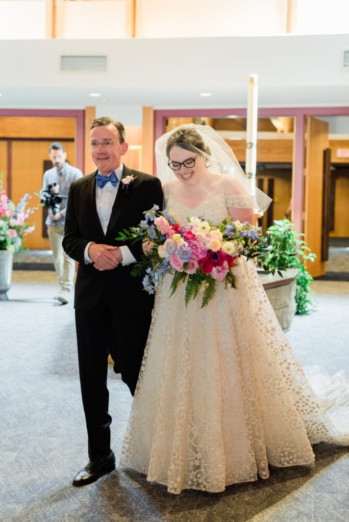 Bride and Father of the Bride walking down the isle at Saint Patrick Parish in Hudson, WI.