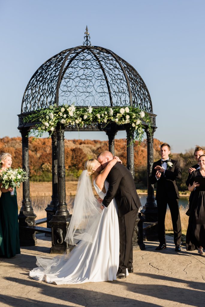 Bride and groom share first kiss at Bavaria Downs.