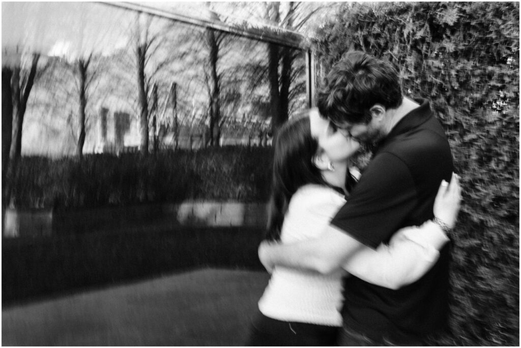 Couple kiss at the Minneapolis Sculpture Garden in blur motion. 