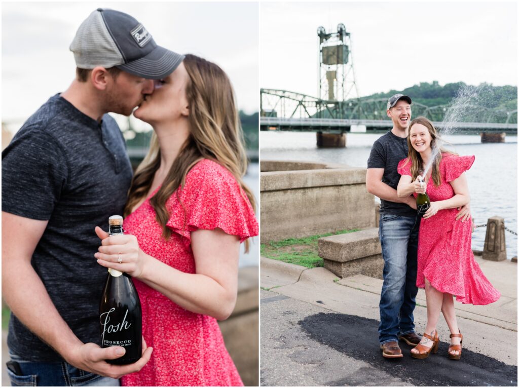 Engaged couple kissing and popping a bottle of champagne in Stillwater, MN.