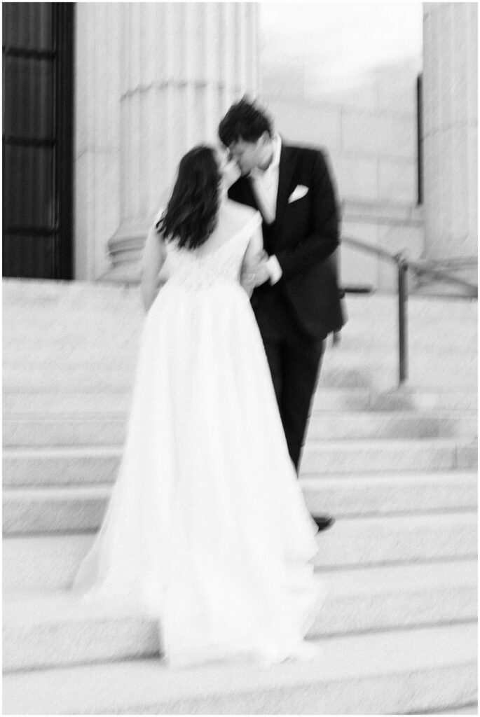 Blury photo of the bride and groom kissing at the Minneapolis Institute of Art