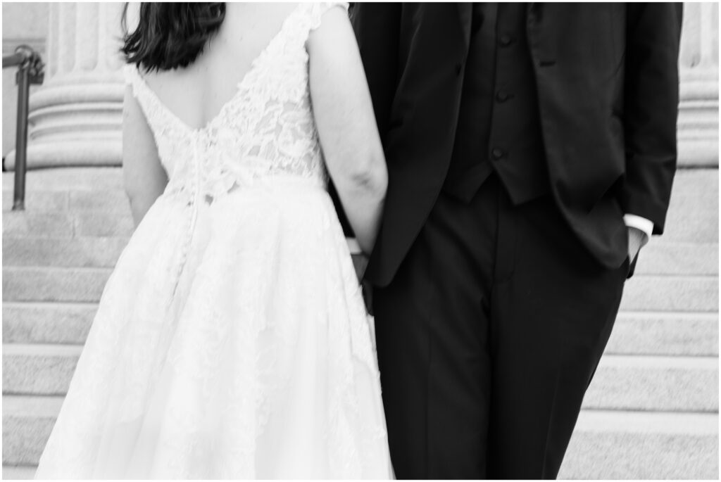 Slight blur photo of bride's dress and groom's tux. 
