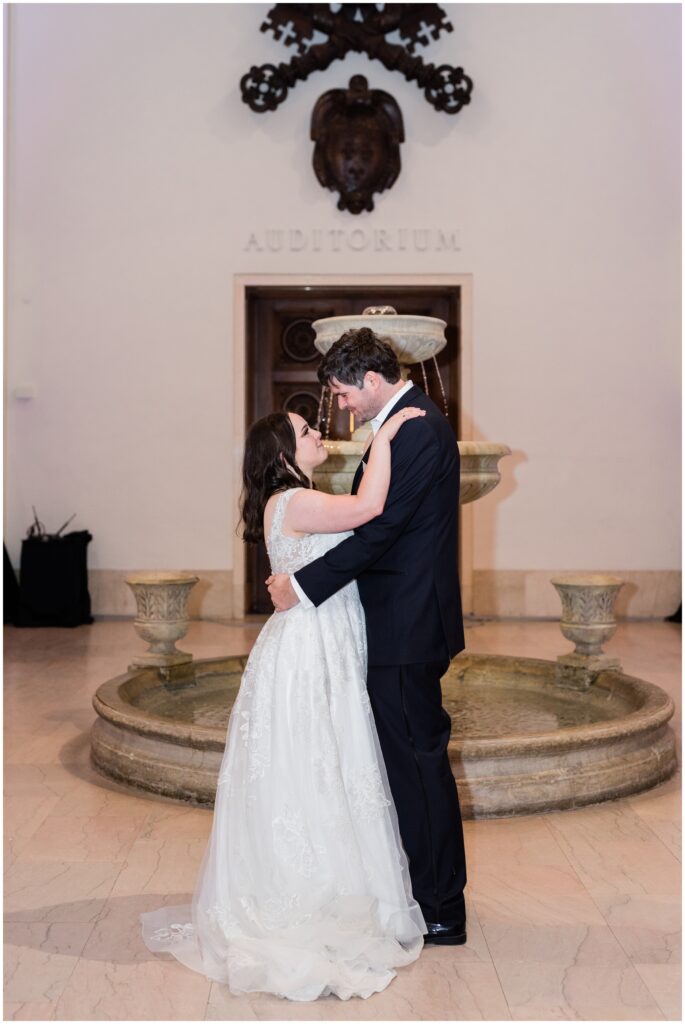 Bride and groom share a first dance at the Minneapolis Institute of Art