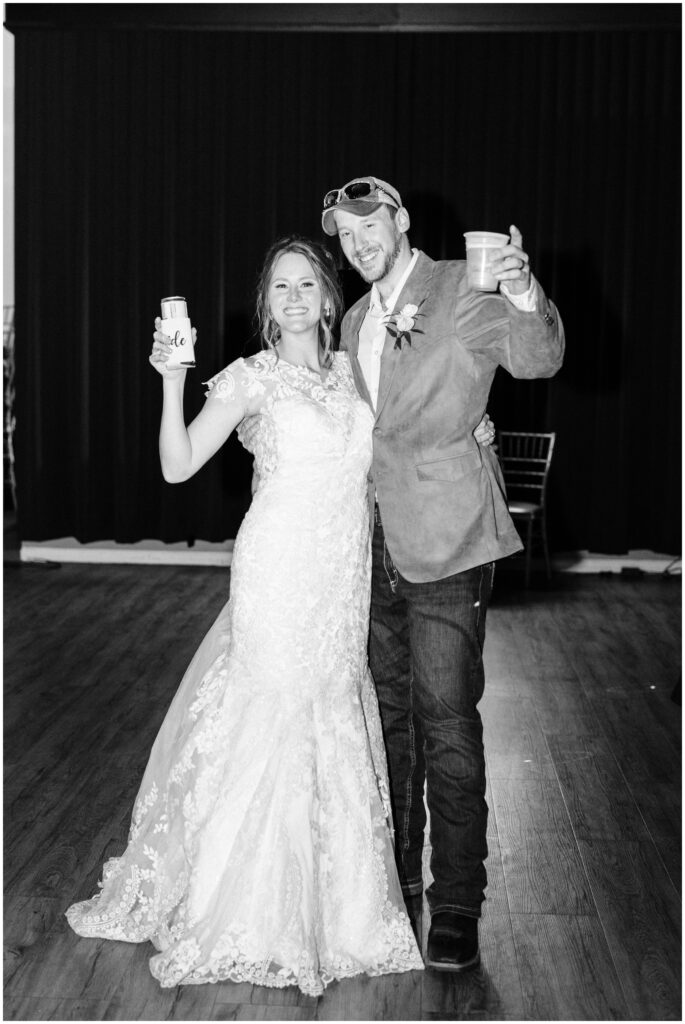 Bride and groom cheers at The Grand Banquet, Stillwater, MN. 