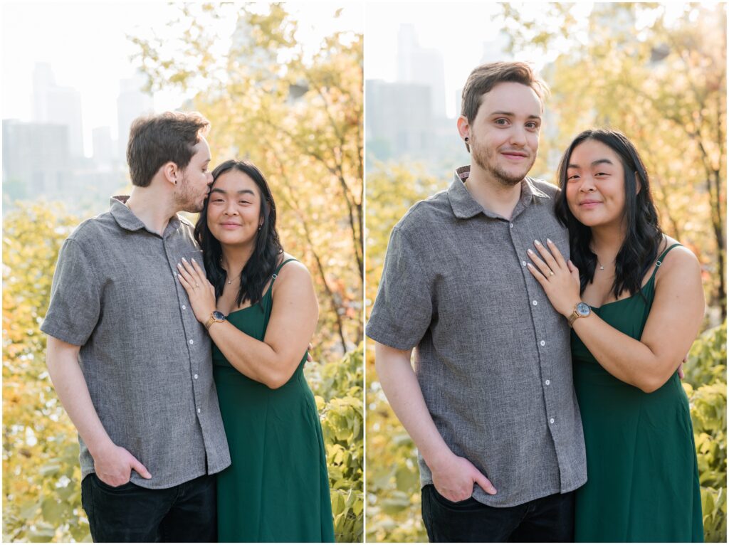 Couple hold each other and pose looking at the camera.