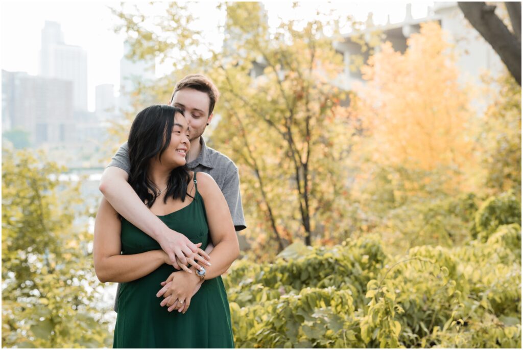 Engagement photos at St. Anthony Main with a bear hug.