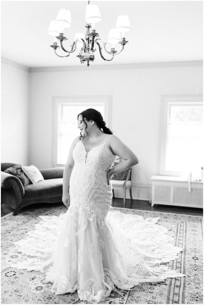 Bride looking over her shoulder in her wedding dress at Cheney Mansion, Oak Park, IL.