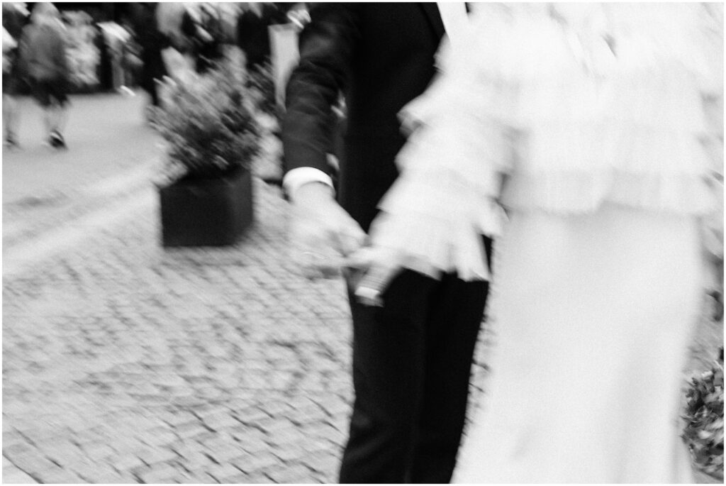 Blurry photo of the bride and groom dancing on the streets of Copenhagen. 