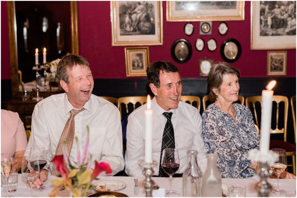 Wedding guests laughing at Restaurant Maven. 