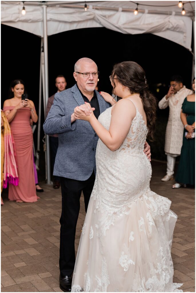 The bride dances with her father at Cheney Mansion. 