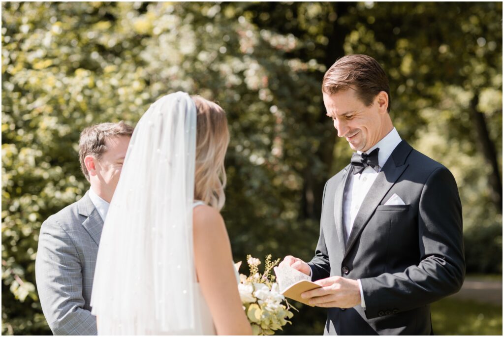 The groom reads his vows during his Copenhagen elopement. 