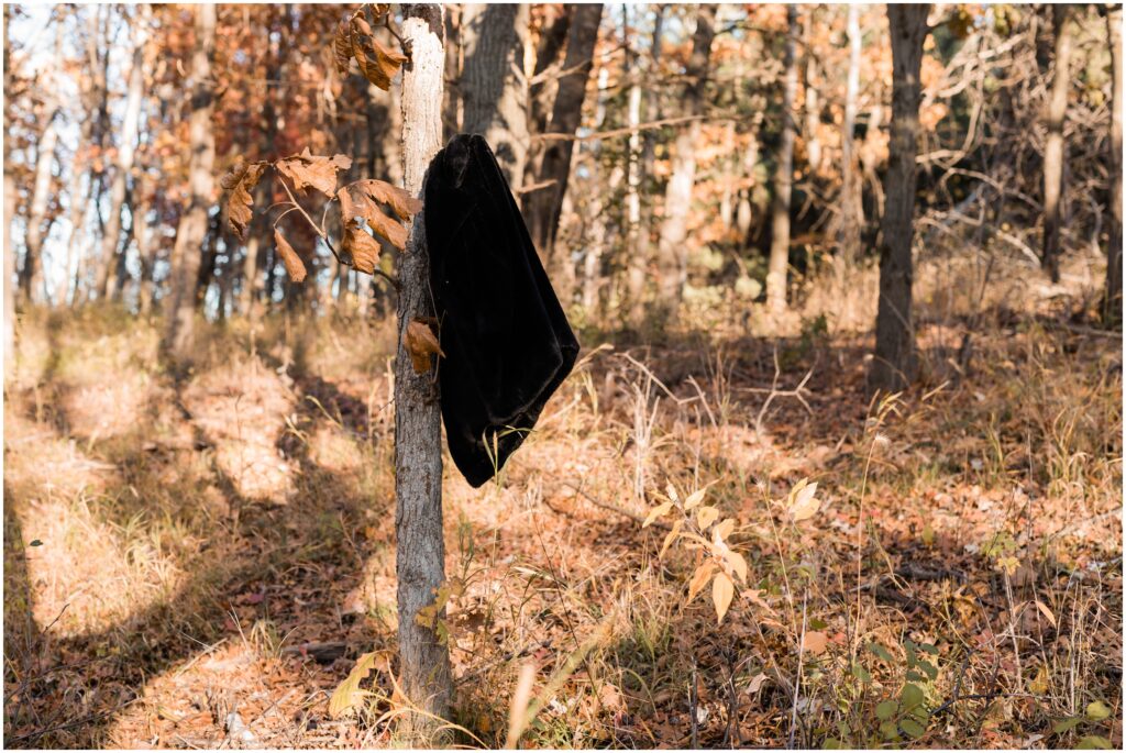 A jacket hanging on a tree. 