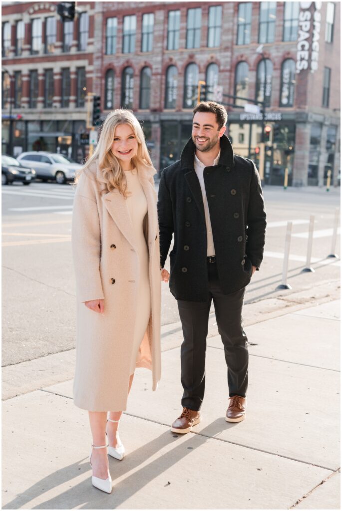 Couple walks downtown Minneapolis.