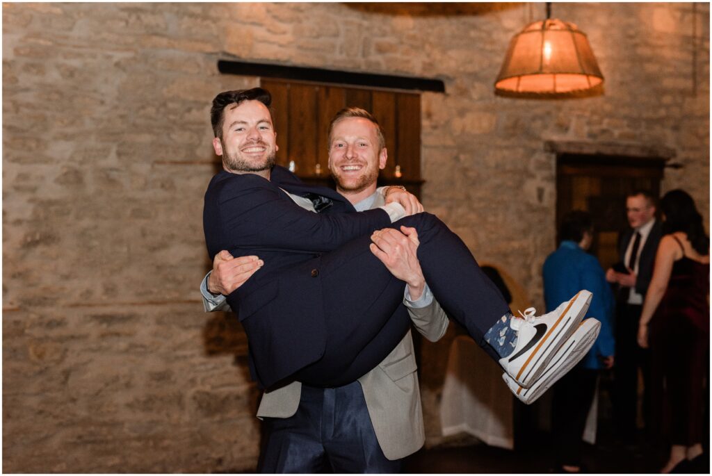 A friend carrying the groom at Aster Cafe.